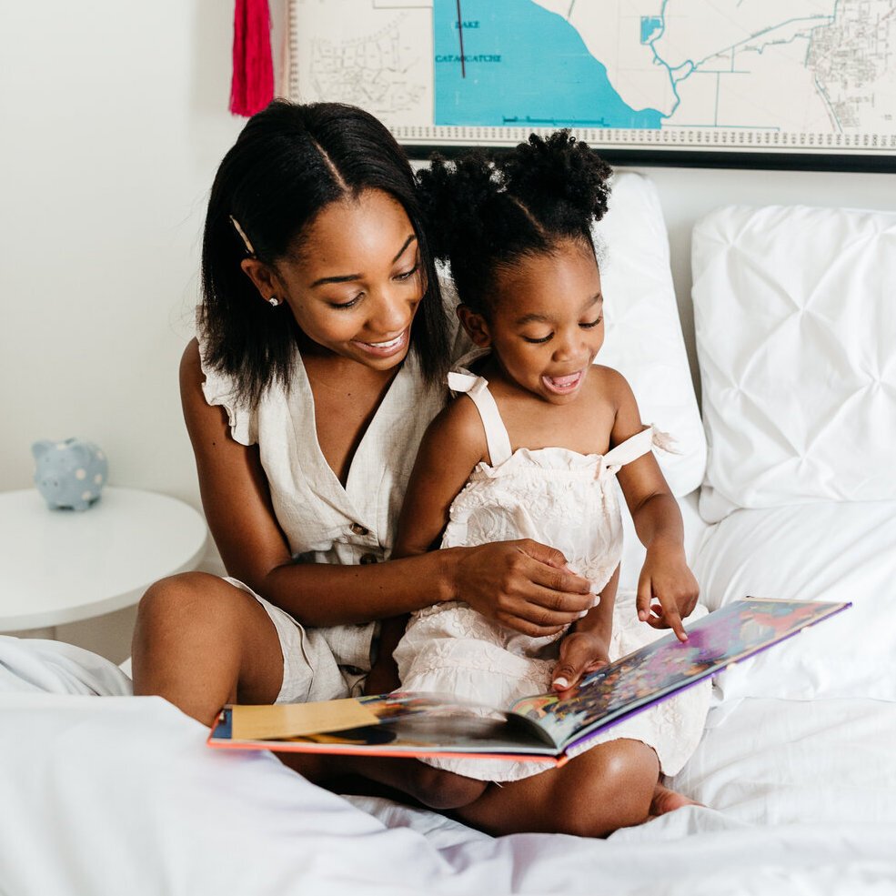 Mom and Daughter Reading together